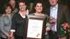 Shelley Smith holds the Linda J. Todd Outstanding Support Staff Achievement Award accompanied by, from left, her aunt, Rita Presley, uncle, Mickey Presley, mother, Connie Salsiccia and her husband, David Smith, Jr.