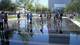 Students traipse through a water feature at the Winspear Opera Center.