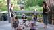 Gabriela Campagnol, assistant professor architecture, right, and students take a break in the Fort Worth Water Gardens.