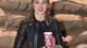 Christina Anderson and the Starbucks 2016 holiday cup she designed. The photo was taken at a cup unveiling party in New York.